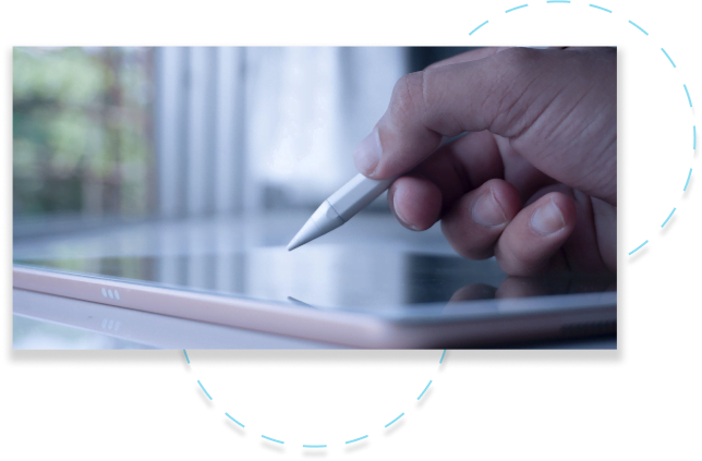 Group-284-5 - Aryo Systems A hand holding a stylus pen interacting with a tablet screen, emphasizing digital creativity and technology.